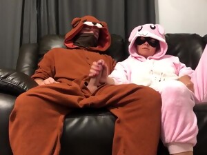 Bunny Pajama Girl Gives Handjob On Couch Watching Tv