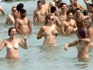 Huge Group Of Nudists Swim In The Ocean